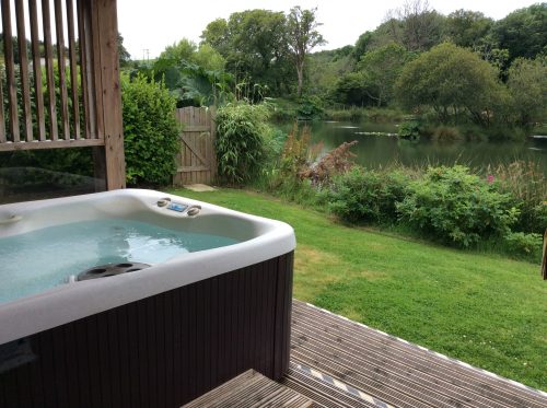 Hot tub and fishing holidays at Woodpecker Lodge. Luxurious accommodation, a private fishing lake and a hot tub for those nights under the stars. Just another day at Nanpusker Lakeside Lodges, Cornwall.